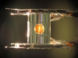 An image of the tiny gold can (known as the hohlraum) with a cutaway showing a fuel capsule inside. Scientists at Lawrence Livermore National Laboratory conducting laser-based nuclear fusion experiments have seen more energy come out of their deuterium-tritium fuel than was put in, they report in Nature.